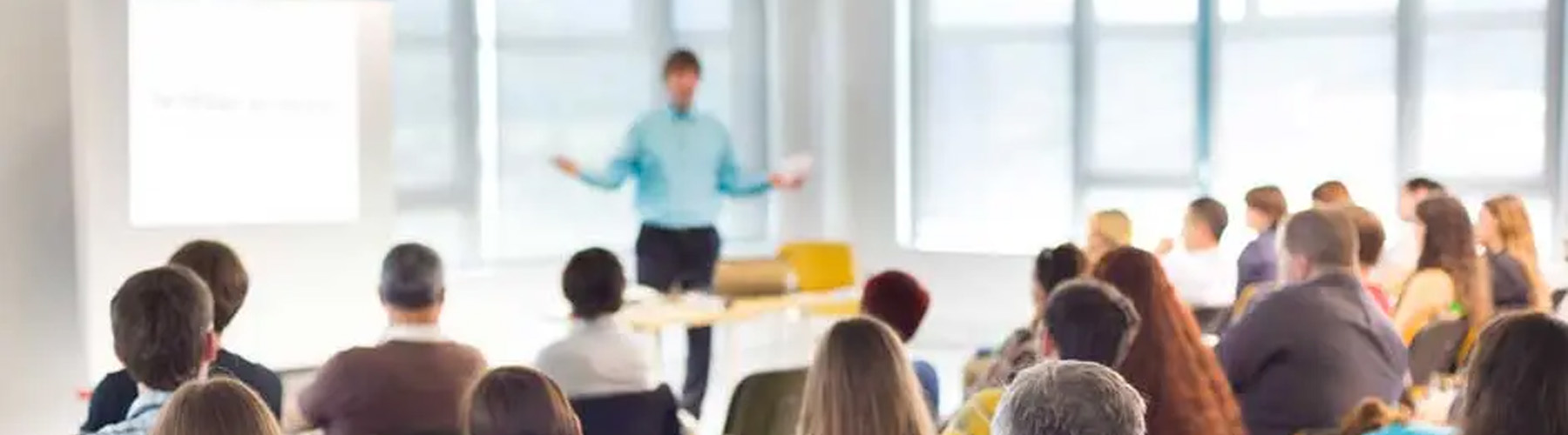 people watching a guest speaker