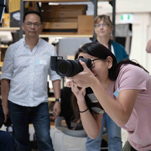 People watching a lady take photos